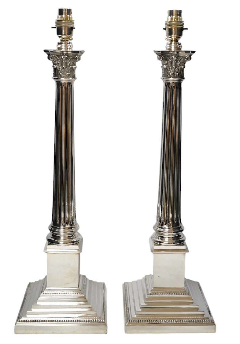 A pair of plated Corinthian column lamp bases, 56cm high including fitting. Condition - good